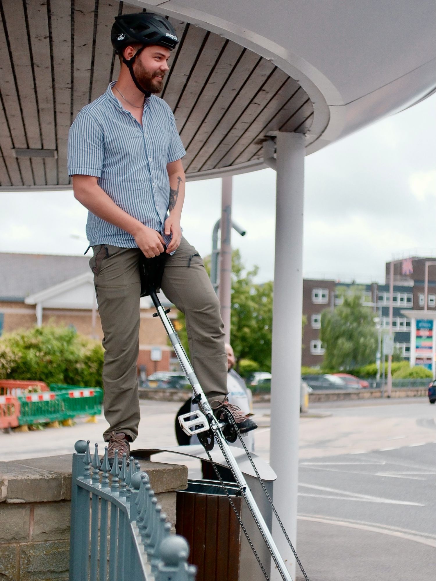 William riding his seven-foot giant unicycle in Sheffield